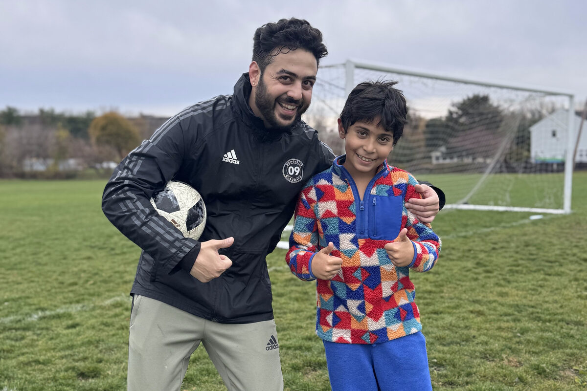 Coach Shaya with a player after a session
